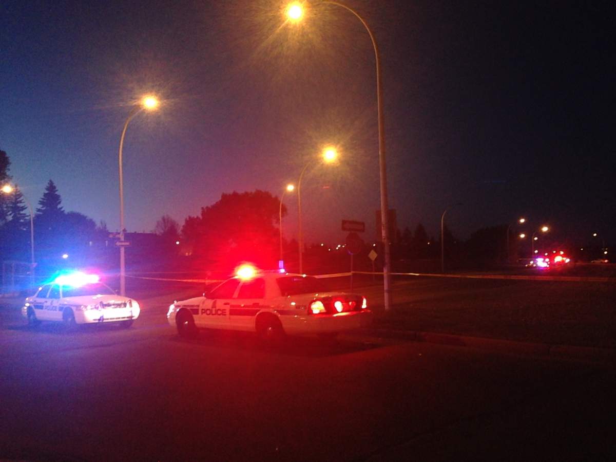 Dozens of police vehicles block of the intersection at Abbottsfield Road and 118th Avenue after a police-involved shooting on Monday night.