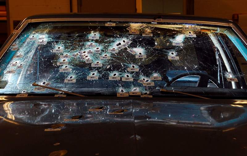 AppleMarkIn this Nov. 30, 2012 file forensics photo released by the Office of the Ohio Attorney General, bullet holes are visible on the windshield and hood of a Chevy Malibu peppered by gunshots after a high-speed chase that ended in the deaths of two unarmed suspects.
