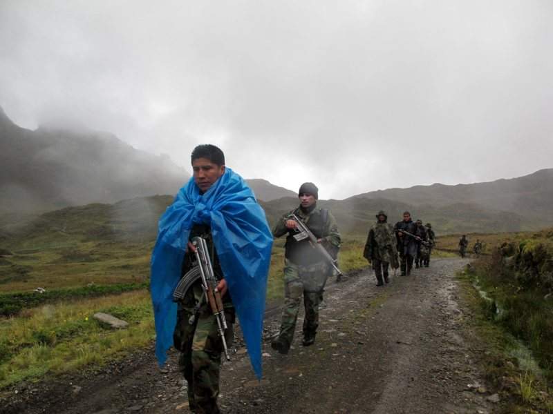 In this Feb. 28, 2015 photo, a patrol of elite DIRANDRO counternarcotics police walks through a puna in Husnay, Peru, after an unsuccessful mission to try to arrest drug-toting backpackers coming from the world’s No. 1 cocaine-producing region.