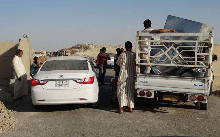 Iraqi family members prepare to leave their hometown of Ramadi. Islamic State militants seized the centre of Ramadi in western Iraq and raised their black flag over the government compound. 