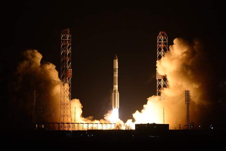 A Russian Proton booster rocket blasts off from the Russian-leased Baikonur cosmodrome in Kazakhstan late Tuesday, March 26, 2013. 