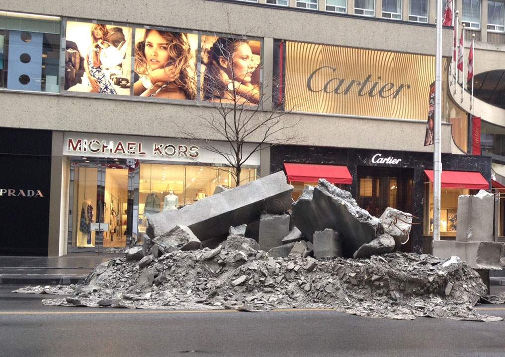 Fake concrete rubble appears on Bloor Street in Toronto's Yorkville neighbourhood on May 10, 2015.