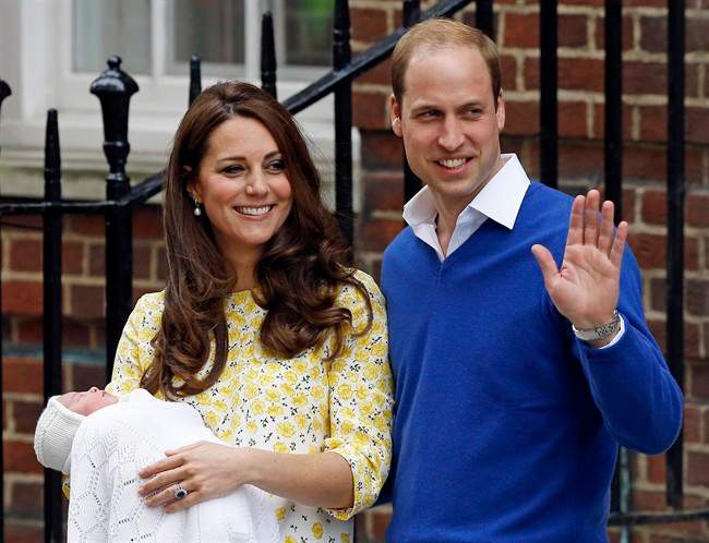 In this Saturday, May 2, 2015. file photo, Kate Duchess of Cambridge and Prince William smile as they carry their newborn baby princess from The Lindo Wing of St. Mary's Hospital, in London Britain's newborn princess has been named Charlotte Elizabeth Diana it was announced on Monday May 4.