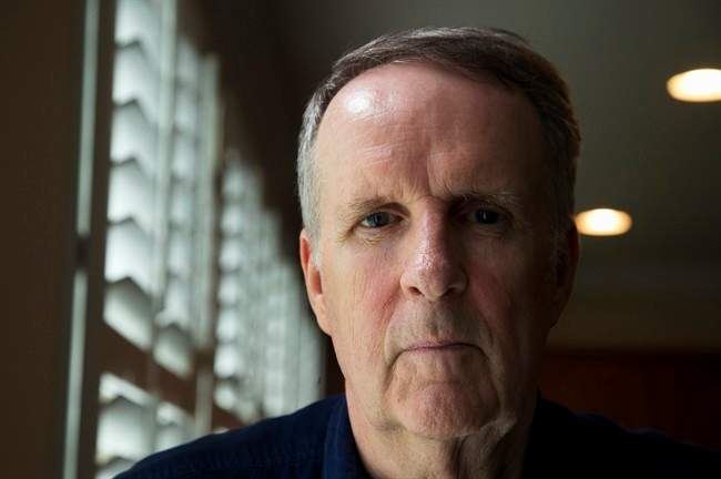 John Ryan poses for a picture in his house in Aldie, Va., Friday, May 29, 2015. For the first time, a major study has shown that a drug targeting the body's disease-fighting immune system may improve survival for the most common form of lung cancer.