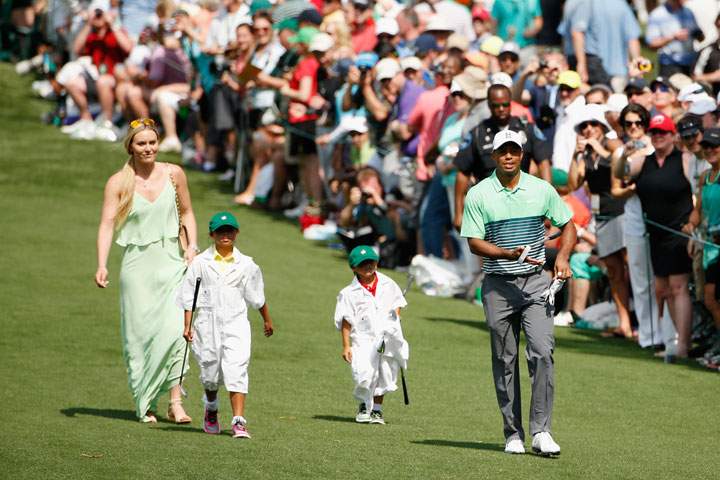 Tiger Woods walks with Lindsey Vonn, son Charlie and daughter Sam during the Par 3 Contest prior to the start of the 2015 Masters Tournament at Augusta National Golf Club on April 8, 2015 in Georgia.