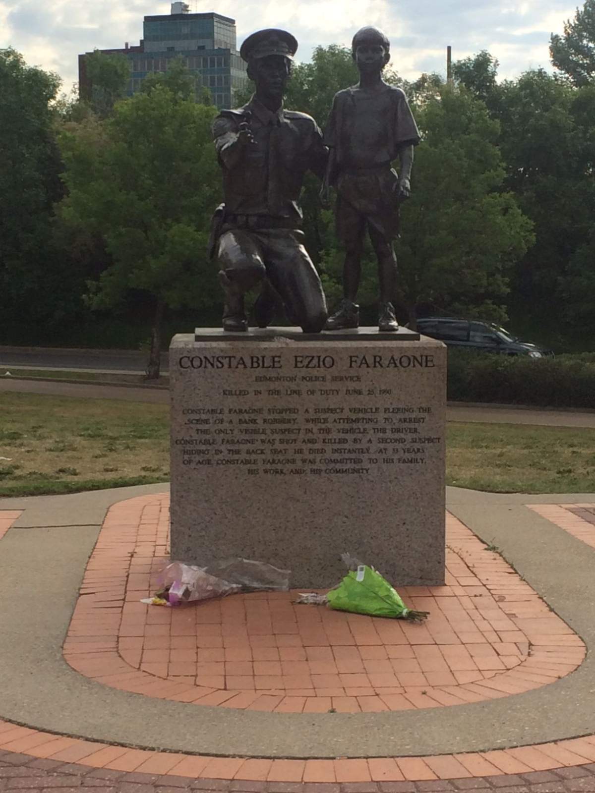 Flowers left in Ezio Faraone Park on Wednesday, June 10, 2015.