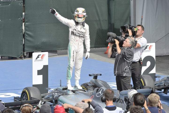 Mercedes driver Lewis Hamilton of Great Britain celebrates after winning the Canadian Grand Prix in Montreal on Sunday, June 7, 2015.