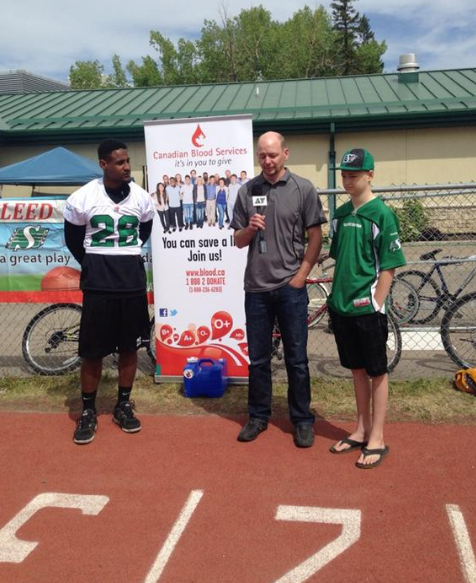 Roughrider running back Anthony Allen, Chris Enns and 13-year-old son Nolan, launch 2015 Bleed Green campaign