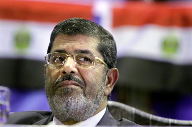In this Monday, April 30, 2012 file photo, Mohammed Morsi, Muslim Brotherhood's presidential candidate, listens during a campaigning conference in Cairo Egypt.
