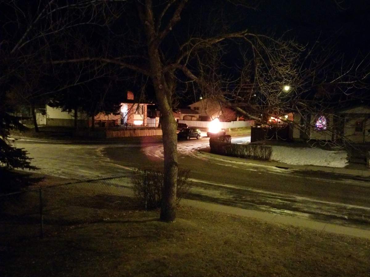 Calgary firefighters extinguish a car fire in the 700 block of Rundleside Drive N.E. on December 22, 1014.