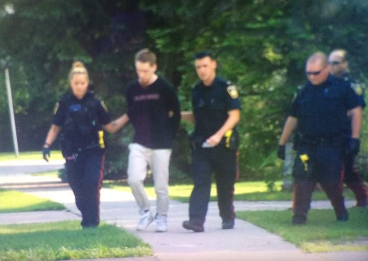 Aaron Driver, 23, is taken into custody on Carlotta Crescent in Winnipeg on Friday, June 26, 2015