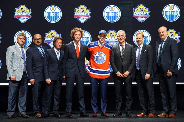 Connor McDavid poses on stage after being selected first overall by the Edmonton Oilers in the first round of the 2015 NHL Draft at BB&T Center on June 26, 2015 in Sunrise, Florida. Connor McDavid poses on stage after being selected first overall by the Edmonton Oilers in the first round of the 2015 NHL Draft at BB&T Center on June 26, 2015 in Sunrise, Florida.