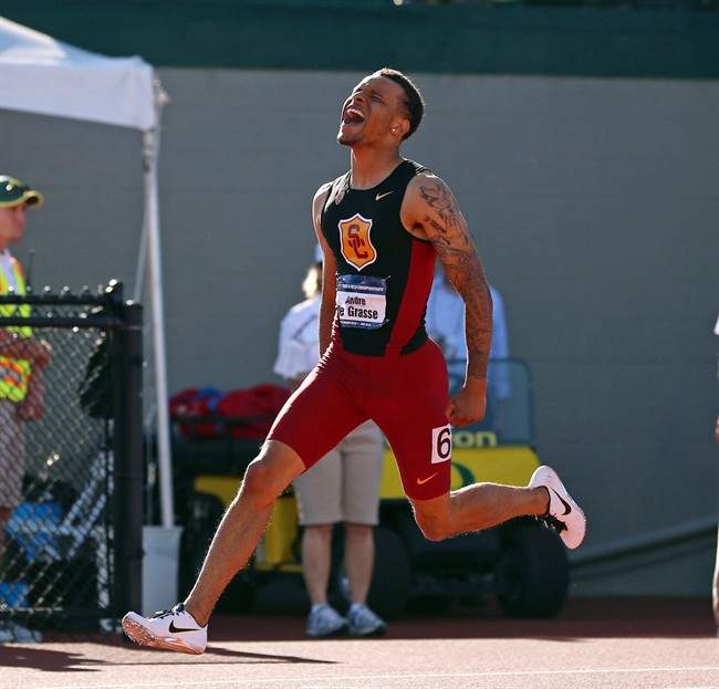 Canadian sprinter Andre De Grasse reacts after winning the 200-meter race during the NCAA track and field championships in Eugene, Ore., Friday, June 12, 2015.