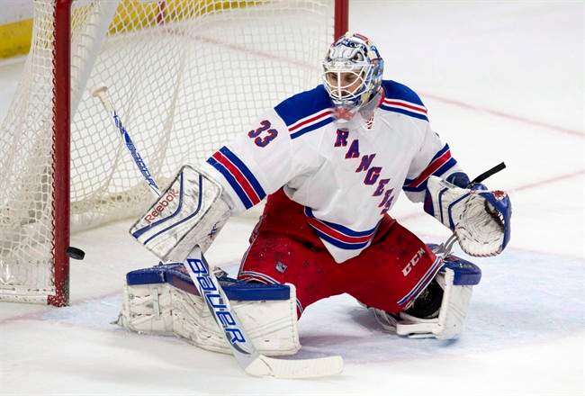 The puck rings off the post behind New York Rangers goalie Cam Talbot during first period NHL action against the Ottawa Senators in Ottawa on March 26, 2015. The Edmonton Oilers got their goaltender. On a busy morning of trades at the NHL draft, the Oilers acquired Cam Talbot from the New York Rangers.