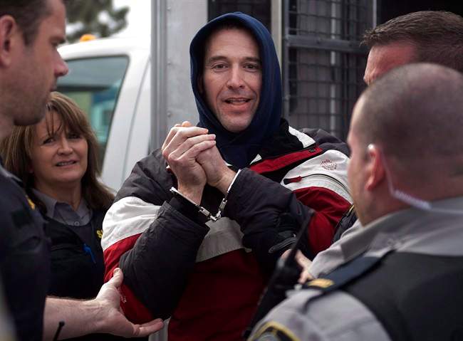 Christopher Phillips, accused of threatening police with a dangerous chemical, arrives for his bail hearing at provincial court in Dartmouth, N.S. on Tuesday, March 17, 2015.