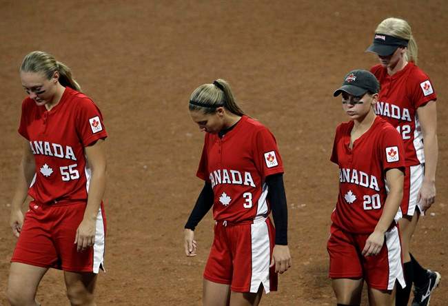 Canada players (from left) Kaleigh Rafter, Lauren Bay Regula, Erin McLean and Melanie Matthews leave the field after losing to Japan in a softball game in the Beijing 2008 Olympics in Beijing, Monday, Aug. 18, 2008.