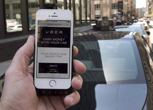 The ride-sharing app Uber is shown on a smartphone in Montreal, Thursday, May 14, 2015. A ruling from a California labour board that Uber drivers are employees of the company and not self-employed contractors sets a precedent that could spell trouble for the ride-sharing service's Canadian operations.