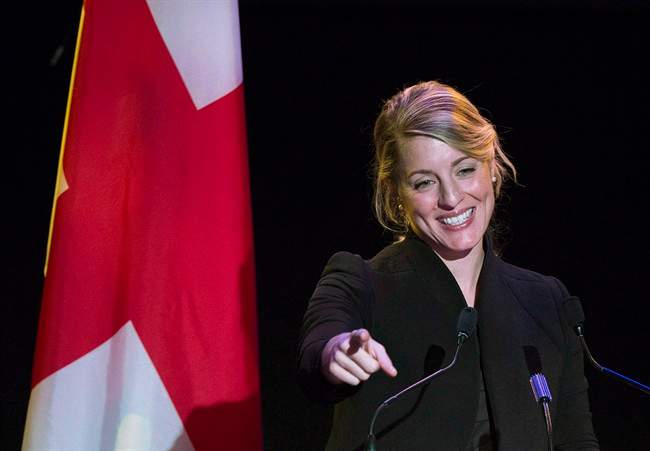 Former Montreal mayoral candidate Melanie Joly gestures as she speaks to supporters at her campaign headquarters on provincial election night in Montreal on November 3, 2013. Joly is seeking the Liberal nomination in Montreal's Ahuntsic-Cartierville riding.