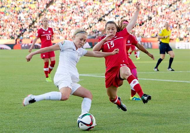 Canada's Allysha Chapman (15) and New Zealand's Kirsty Yallop (11) battle for the ball during FIFA World Cup.