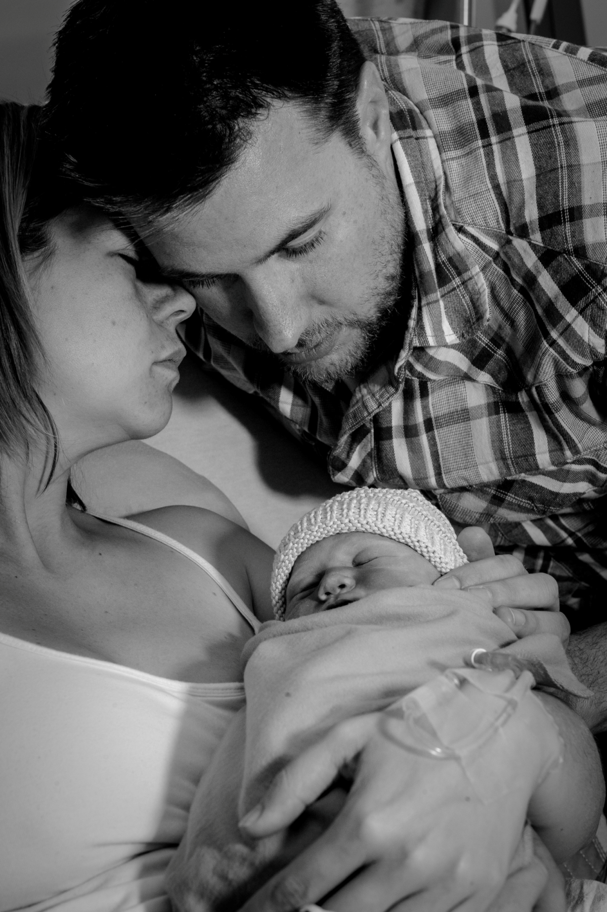 Caitie with her husband and baby Elizabeth.