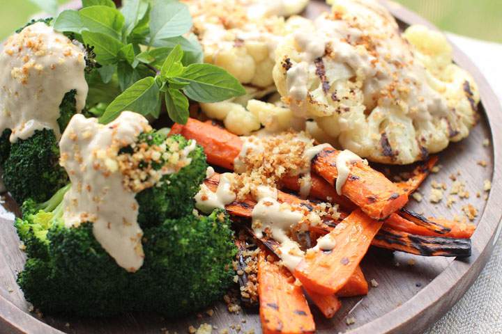 This June 8, 2015 photo shows grilled vegetables with tahini sauce and spicy panko in Concord, N.H. This dish is from a recipe by Sara Moulton.