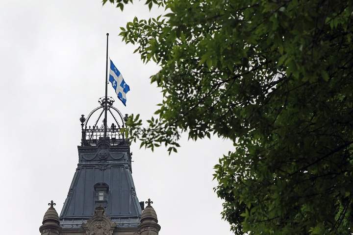 The National assembly lowers its flag after learning that Jacques Parizeau has died, on May 2, 2015.