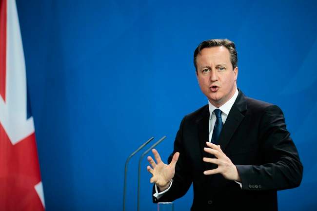 British Prime Minister David Cameron speaks to media in Berlin, Germany, Friday, May 29, 2015.
