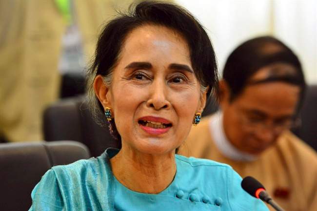 Myanmar's opposition leader Aung San Suu Kyi speaks during a press briefing at a parliament building Thursday, June 25, 2015, in Naypyitaw, Myanmar. Myanmar's parliament voted against constitutional amendments that day, ensuring that the military's veto power remains intact and that Suu Kyi cannot become president in an election this year.