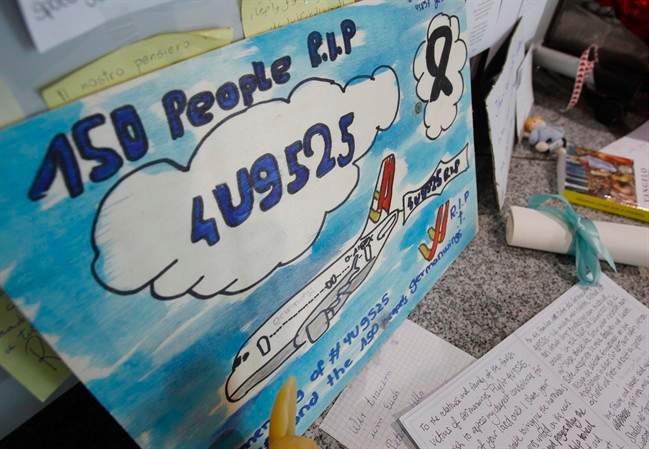 A painting is put up in a terminal of the airport commemorating the people who died in the Germanwings plane crash in France in Duesseldorf, Germany, Wednesday, June 10, 2015.