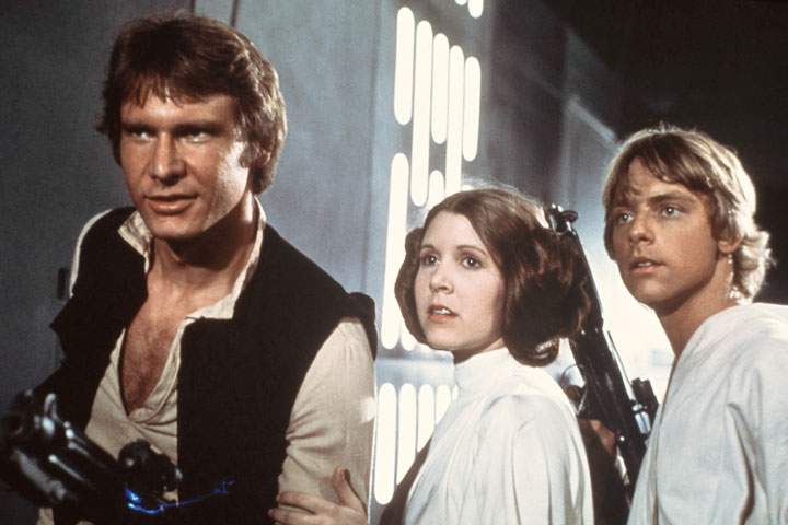 Harrison Ford, Carrie Fisher and Mark Hamill in a scene from 1977’s ‘Star Wars.’