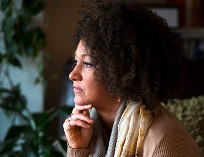 In this March 2, 2015 file photo, Rachel Dolezal, president of the Spokane chapter of the NAACP, poses for a photo in her Spokane, Wash. home. 