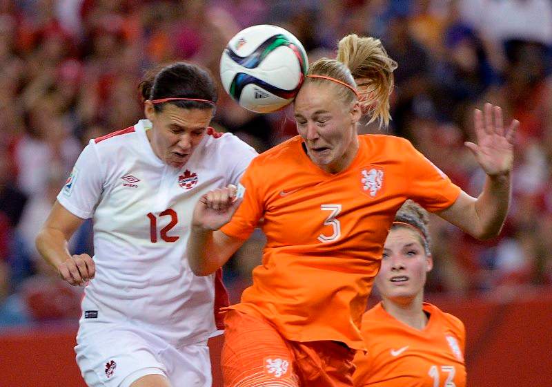 Canada's Christine Sinclair (12) and Netherlands' Stefanie Van Der Gragt (3)battle for the ball during second half FIFA Women's World Cup soccer in Montreal on Monday, June 15, 2015. 