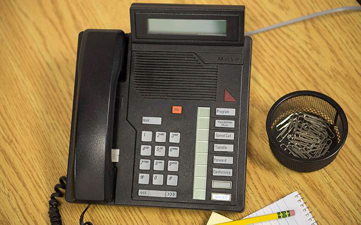 A telephone sits on a desk in a Toronto office on Friday May 16, 2014. The Federal Court of Appeal tossed out abid to overturn the federal election results from a Guelph, Ont. courtroom.
