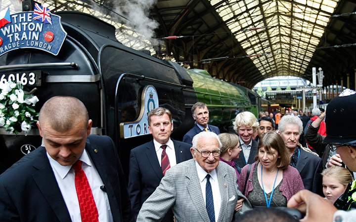 Nicholas Winton, centre, who organized the Winton Train rescue of children 70 years ago at Liverpool Street station in London, Friday, Sept. 4, 2009. 