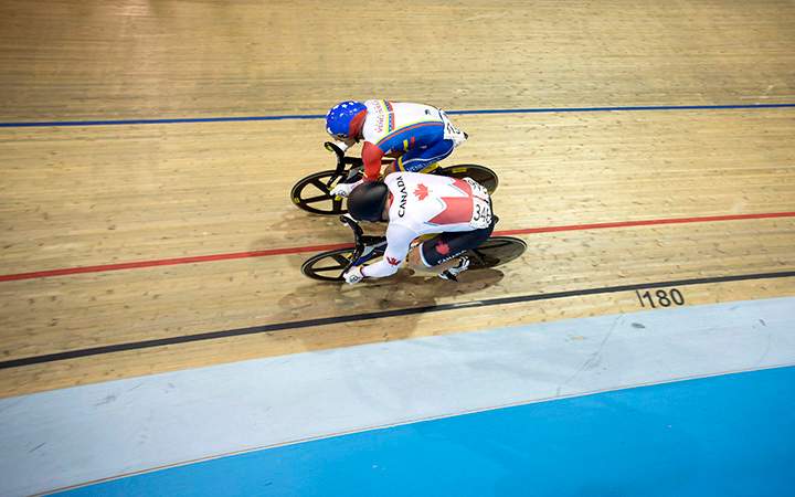 Canada's Hugo Barrette competes against Venezuela's Hersony Canelon Vera during the men's sprint semifinals at the Pan Am games in Milton, Ont., on Saturday, July 18, 2015. Barrette would go on to win the gold medal race.