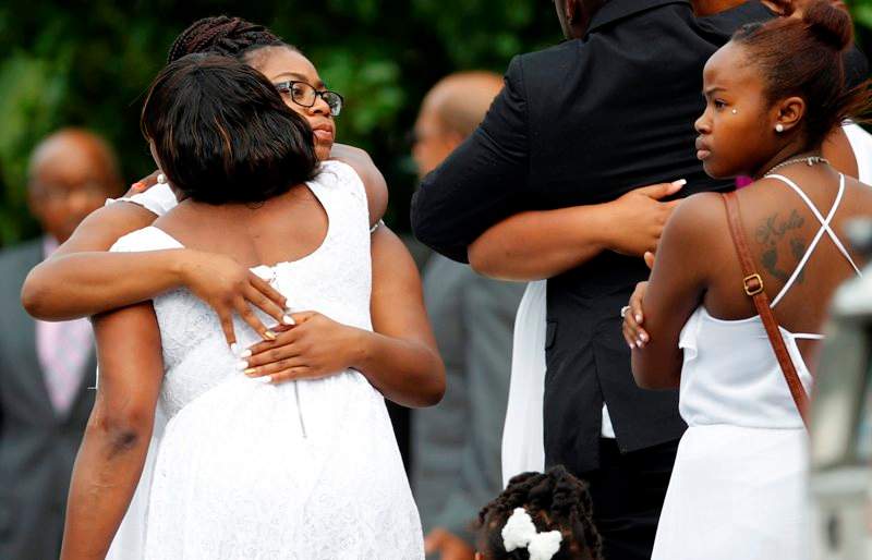 Mourners arrive to mourn the death of Sandra Bland at the DuPage African Methodist Episcopal Church Saturday, July 25, 2015, in Lisle, Ill.