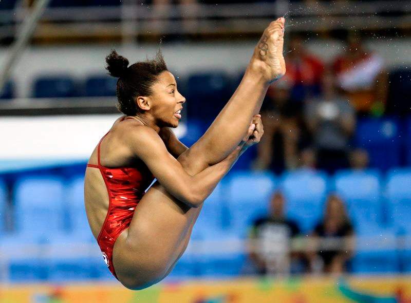 Jennifer Abel of Canada dives during the final round of the women's 3-meter springboard event at the Pan Am Games Sunday, July 12, 2015, in Toronto. Abel won the gold medal in the event. 