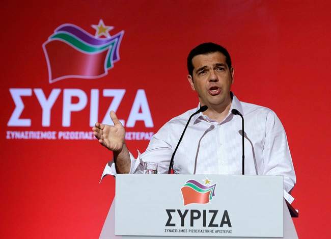 Greek Prime Minister Alexis Tsipras addresses a meeting of his ruling radical left Syriza party's central committee in Athens, on Thursday, July 30, 2015. Tsipras called for an extraordinary party congress in September, after Greece is expected to seal a new bailout deal with its international creditors, in a bid to end a rebellion by his hardline lawmakers that is threatening to topple his coalition government. (AP Photo/Thanassis Stavrakis).