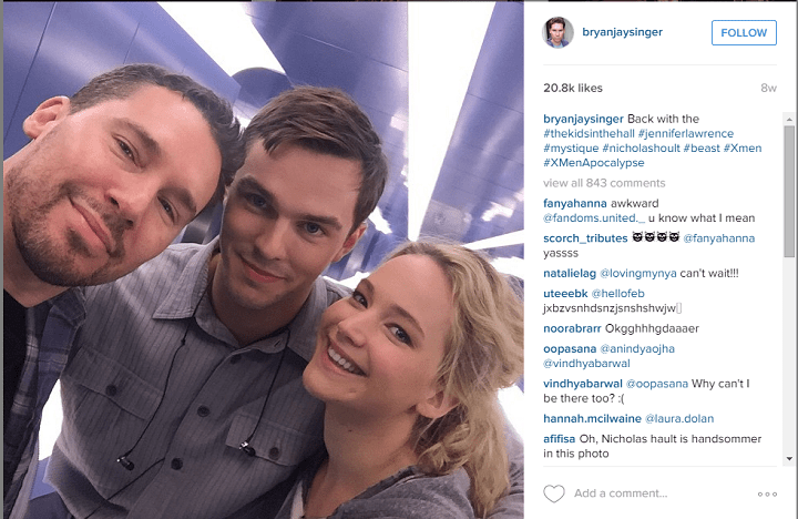 XMen director Bryan Jay Singer snaps a picture with Jennifer Lawrence and Nicholas Hoult on set.