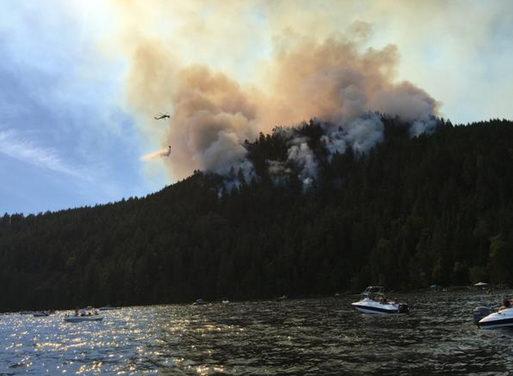 Crews work to slow the spread of a fire on Dog Mountain near Port Alberni on July 4, 2015.