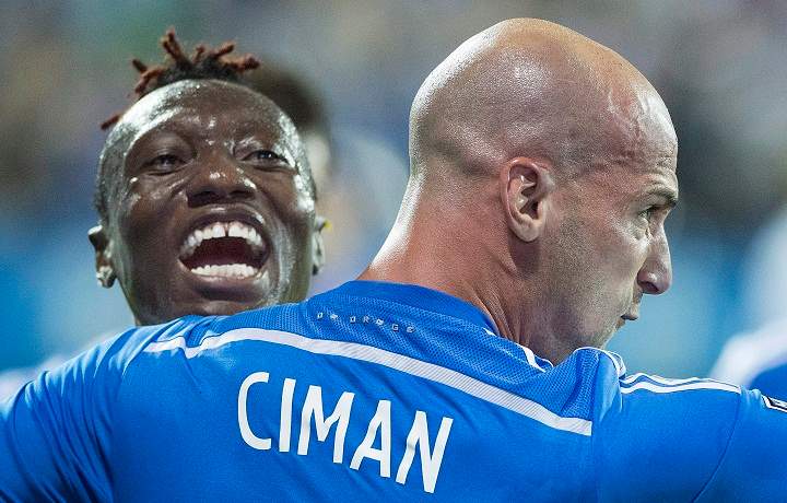 Montreal Impact's Laurent Ciman, right, celebrates with teammate Dominic Oduro after scoring against the Seattle Sounders during second half MLS soccer action in Montreal, Saturday, July 25, 2015.