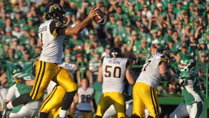 Hamilton Tiger-Cats C.J. Gable picks up yards against the Saskatchewan Roughriders during second half CFL action in Regina on Sunday, July 26, 2015. The Tiger-Cats downed the Roughriders 31-21, the fifth straight loss for the Riders.