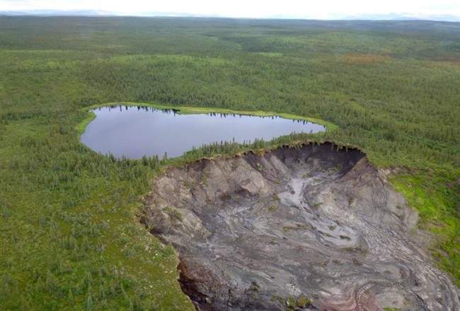 A small lake in the Northwest Territories next to one of many giant-sized permafrost slumps changing the territory’s landscape on a scale not seen since the last Ice Age.