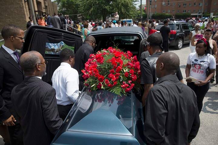 The casket of Samuel Dubose is transported to a hearse during his funeral at the Church of the Living God in the Avondale neighborhood of Cincinnati, Tuesday, July 28, 2015. Dubose was fatally shot by a University of Cincinnati police officer who stopped him for a missing license plate.