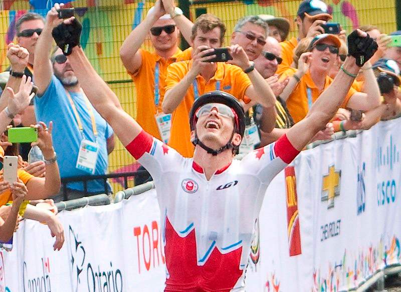 Raphael Gagne reacts as he crosses the finish line to win gold for Canada at the Hardwood Mountain Bike Park in Oro-Medonte, Ont. in the final of the men's mountain bike event at the 2015 Pan American Games on Sunday, July 12, 2015. 