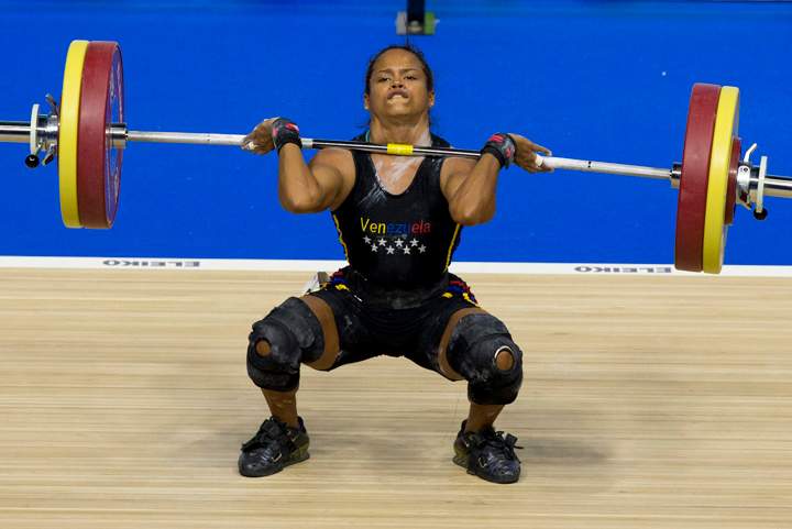Venezuela's Genesis Rodriguez Gomez attempts a lift in the women's 53kg weightlifting at the Pan Am Games in Oshawa, Ontario, Sunday, July 12, 2015.
