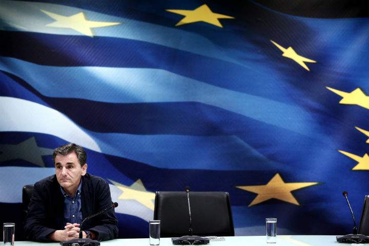 Newly appointed Greek Finance Minister Euclid Tsakalotos looks on during a handover ceremony at the Finance Ministry in Athens on July 6, 2015.