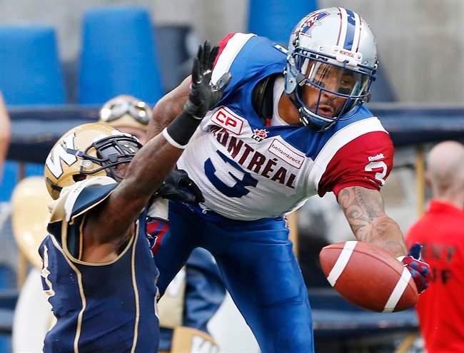 Winnipeg Blue Bombers' Demond Washington (7) defends as Montreal Alouettes' Cody Hoffman (3) can't haul in this pass in the Bombers' end zone during the first half of CFL action in Winnipeg Friday, July 10, 2015.