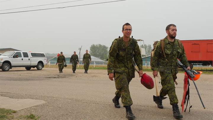 Canadian Forces troops getting ready to deploy from Prince Albert on July 7, 2015 to assist with fighting wildfires in northern Saskatchewan.