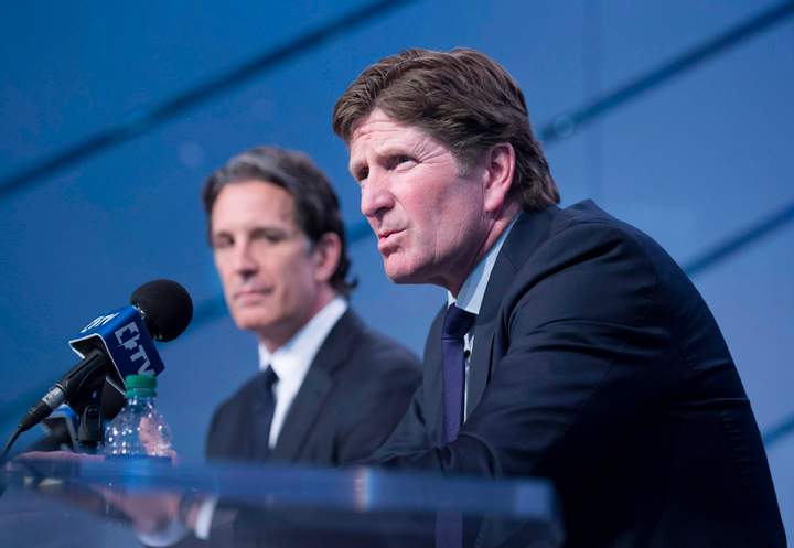 Toronto Maple Leafs new head coach Mike Babcock, right, speaks to reporters with president Brendan Shanahan during a press conference in Toronto on Thursday, May 21, 2015.